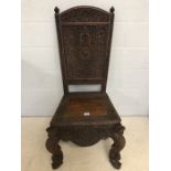 Vintage Burmese solid teak heavily carved side chair, approx 119cm height at back