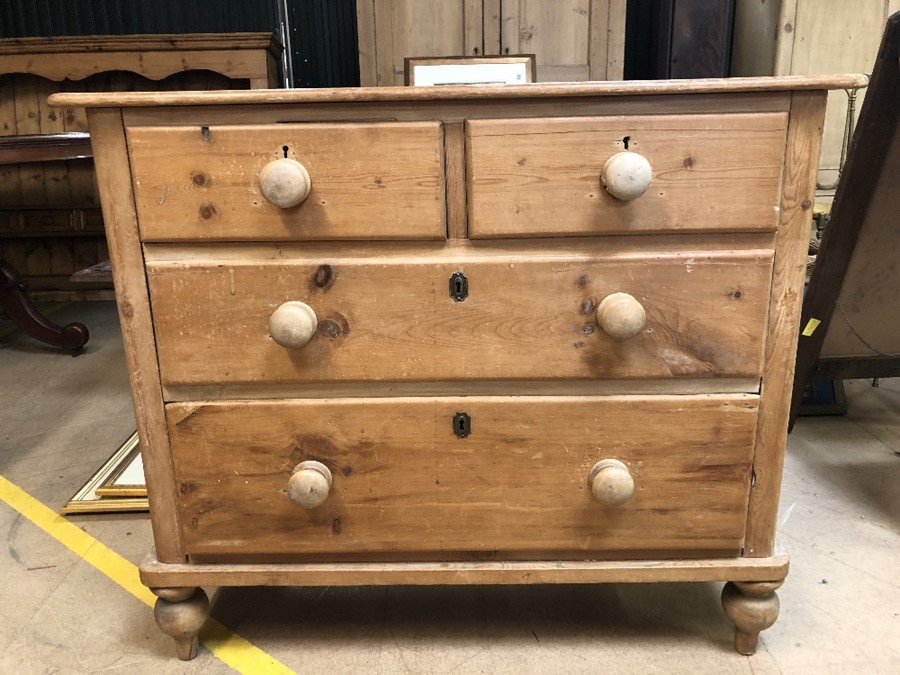 Antique pine chest of four drawers on turned feet, approx 100cm x 46cm x 85cm tall