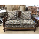 Early 20th Century cane-backed two seater Bergere sofa with upholstered cushions