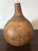 Large decorative gourd with picture of an oxe with a bird on its back signed W Murangi with original