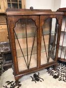 Glass shelved Art Deco display cabinet on ball and claw feet