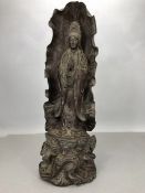 Wooden carved hard wood Tibetan shrine with carved buddha enveloped in a leaf, approx 49cm in