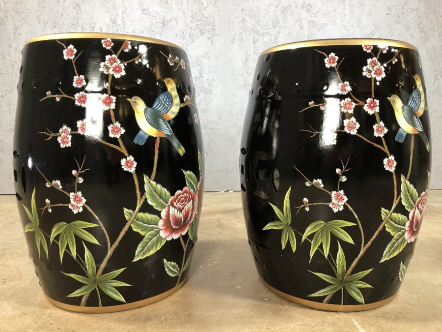 Pair of black porcelain barrel seats / stools, approx 46cm in height