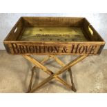 Wooden vintage style tray table stamped Brighton Pier, approx 65cm x 45cm x 80cm tall