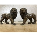 Pair of bronze lions, each approx 23cm in height