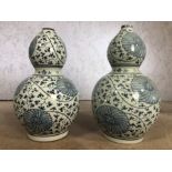 Pair of large blue and white gourd vases, each approx 39cm in height