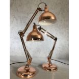 Pair of large copper coloured angle-poise lamps, each approx 70cm in height fully extended