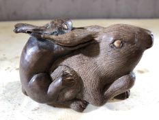 Japanese carved wooden rabbits, approx 5cm x 8cm