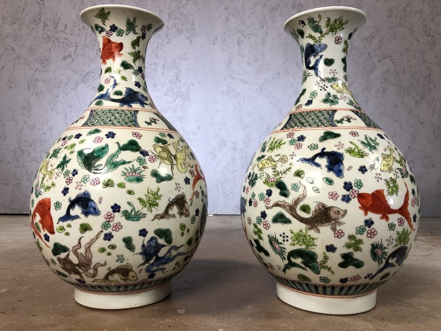 Pair of large Chinese vases with fish design, approx 38cm in height