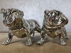 Pair of silver coloured figures of bulldogs, each approx 22cm in height x 40cm in length