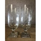 Pair of large glass hurricane lamps, each approx 40cm in height