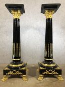 Pair of large black marble and gilt pedestals on claw feet, each approx 136cm in height