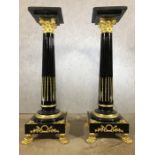 Pair of large black marble and gilt pedestals on claw feet, each approx 136cm in height