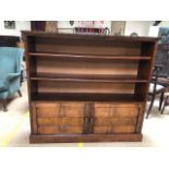 Open book case with two shelves and two cupboards under, approx 132cm x 32cm x 122cm tall