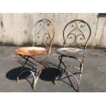 Pair of heavy wrought iron circular seated Garden Bistro chairs