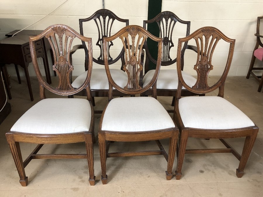 Set of five shield back dining chairs with upholstered seats and wheatsheaf design, to include two
