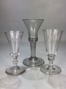 Two small Georgian ale glasses with engraving, along with a further Georgian glass with tulip shaped