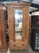 Single pine wardrobe with carved detailing, central mirror and drawer to base, approx 84cm x 40cm