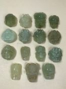 Collection of pale green, natural stone, carved Chinese / Eastern objects, possibly buckles, the