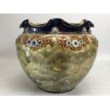 Royal Doulton Stoneware vase with crimp edge rim, decorated with floral sprays on a mottled green