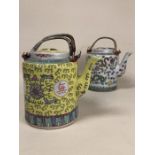 Pair of Chinese lidded tea pots with cane handles and floral or dragon design, each approx 15cm to