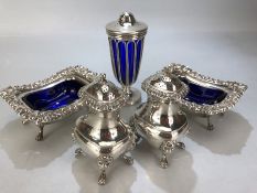 Silver plated cruet set with blue glass liners, salts, sugar shaker etc.....