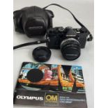 Olympus black OM-1 camera with 50mm F/1.8 Zuiko with case