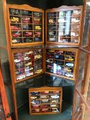 Collection of five display cased model cars