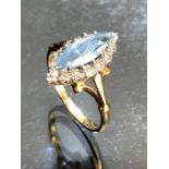 18ct Gold Marquise ring with faceted Oval pale Sapphire approx 12mm long and surrounded by