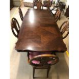 Large extendable dining room table, approx 180cm x 112cm (unextended) with eight shield back