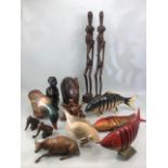 Collection of carved wooden Chinese / Eastern /Tribal items to include articulated fish, oxen,