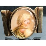 Gold Belt Buckle with a hand painted miniature of a young girl, engraved to the reverse and dated