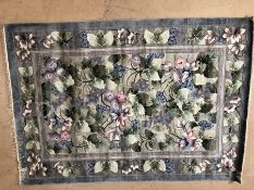 Chinese silk steel blue ground rug with exotic floral design, approx 170cm x 243cm