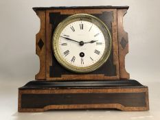 19th Century French mantel clock with enamel dial, in working order, approx 21cm in height