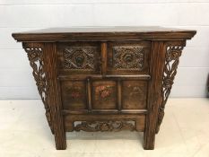 Eastern style chest with carved drawers and hand painted floral panels, carved flower detailing to