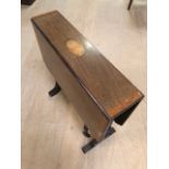 Inlaid drop leaf sofa table on turned legs with castors, approx 67cm x 54cm x 56cm tall