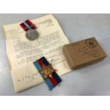 Two WWII medals: The 1939m- 1945 star and the Defence medal unmarked in original box addressed to GW
