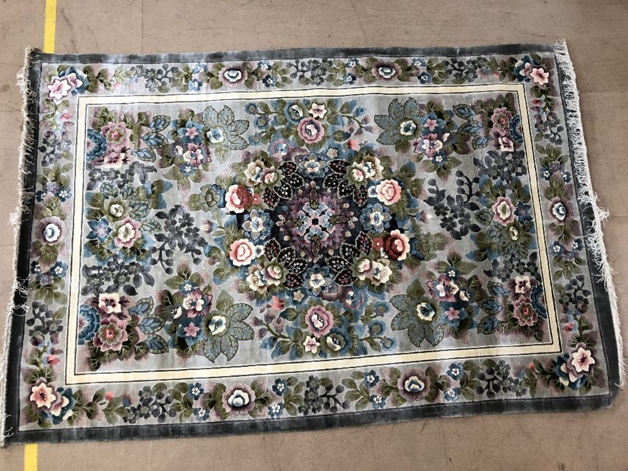 Chinese silk soft green ground rug with floral design, approx 168cm x 245cm