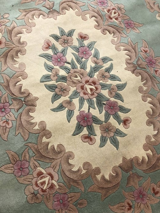Large Chinese Oriental wool pale green ground rug with floral design, approx 330cm x 244cm - Image 2 of 3