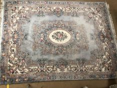 Very large Chinese Oriental wool pale blue ground rug with floral design, approx 374cm x 275cm
