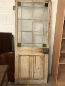 Antique pine door with glass panels and green glass inserts to corners, approx 73cm x 181cm