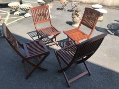 Set of four folding teak garden chairs