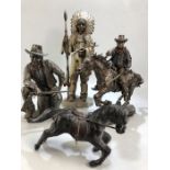 Two cast figurines of John Wayne, the tallest approx 26cm in height, along with a Leonardo