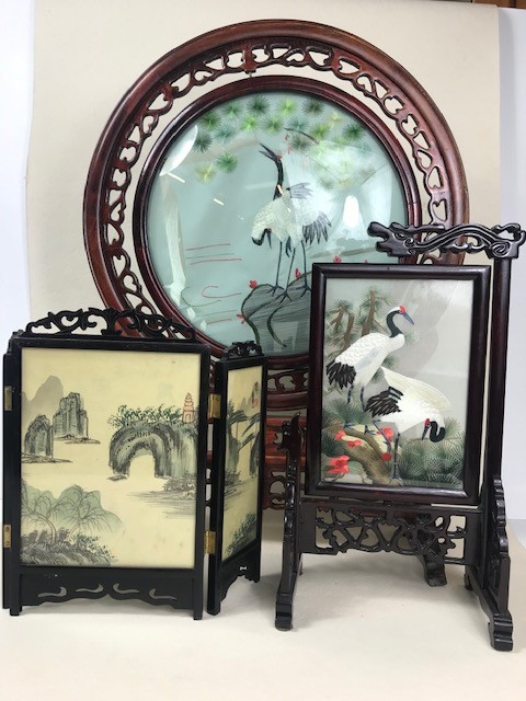 Three Chinese screens, two on silk, all with pierced wooden frames, the largest approx 57cm in
