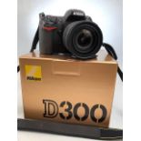 Nikon: A boxed Nikon D300 SLR camera body, complete with lens, Nikkor 16- 85mm, 1:3.5-5.6G plus