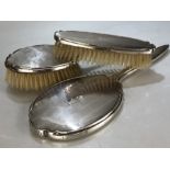 Silver Hallmarked dressing table set of two brushes and a handheld mirror