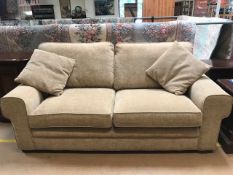 Modern fawn fabric two/three seater sofa, approx 200cm in length