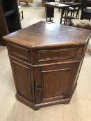 Oak corner cupboard with lidded top