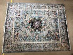 Large Chinese silk green ground rug with floral design, approx 248cm x 304cm