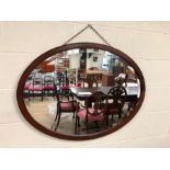 Oval mahogany-framed bevel-edged mirror approx 96cm wide